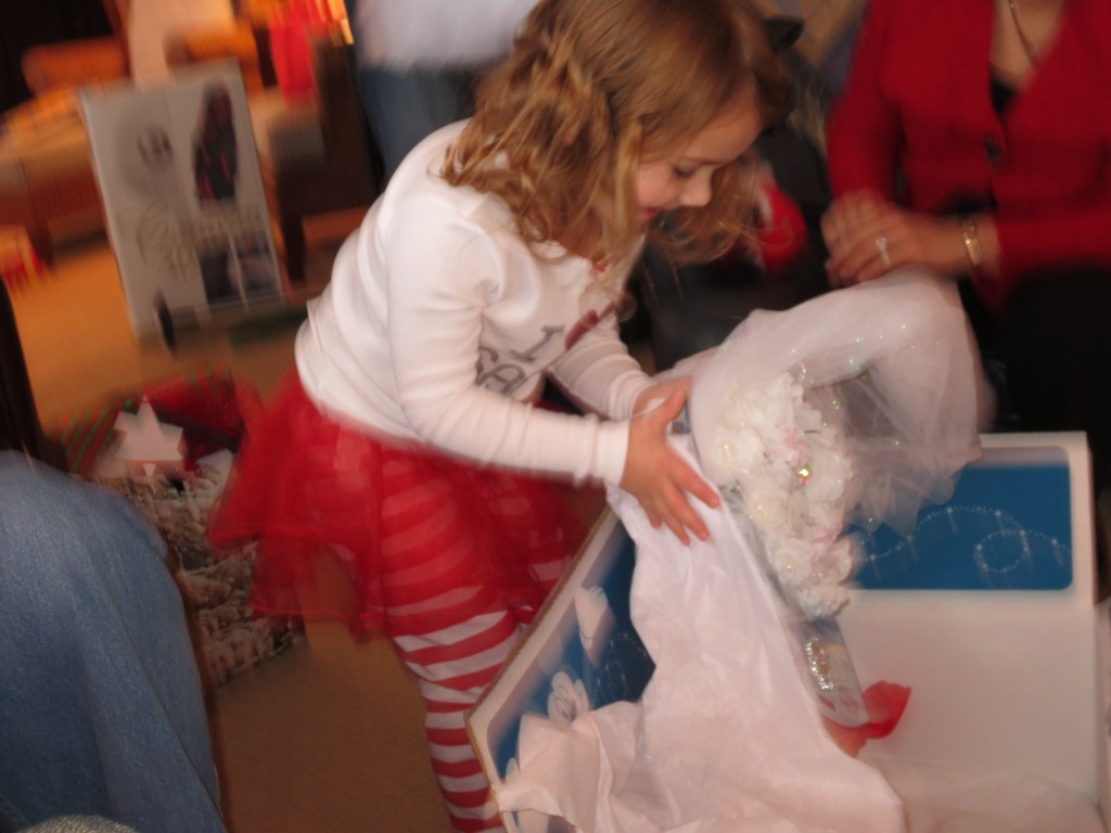 Sophia opening her Cinderella Wedding gown from Gram and Grandpa.