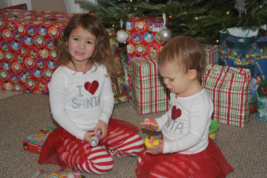 Opening their gifts from their stockings.